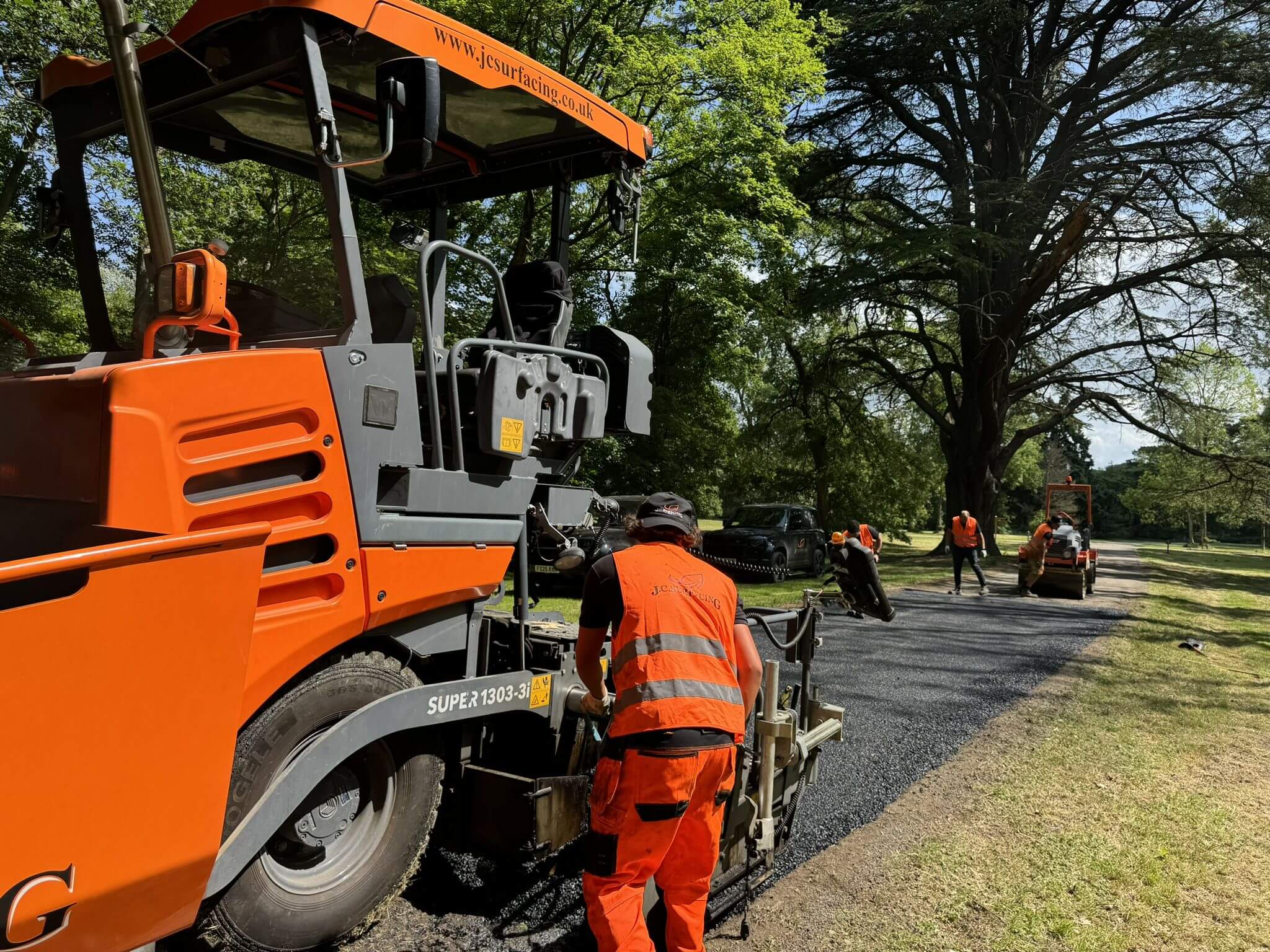 JC Surfacing laying new road surface on driveway of Golf Course JC Surfacing laying new road surface on driveway of Golf Course