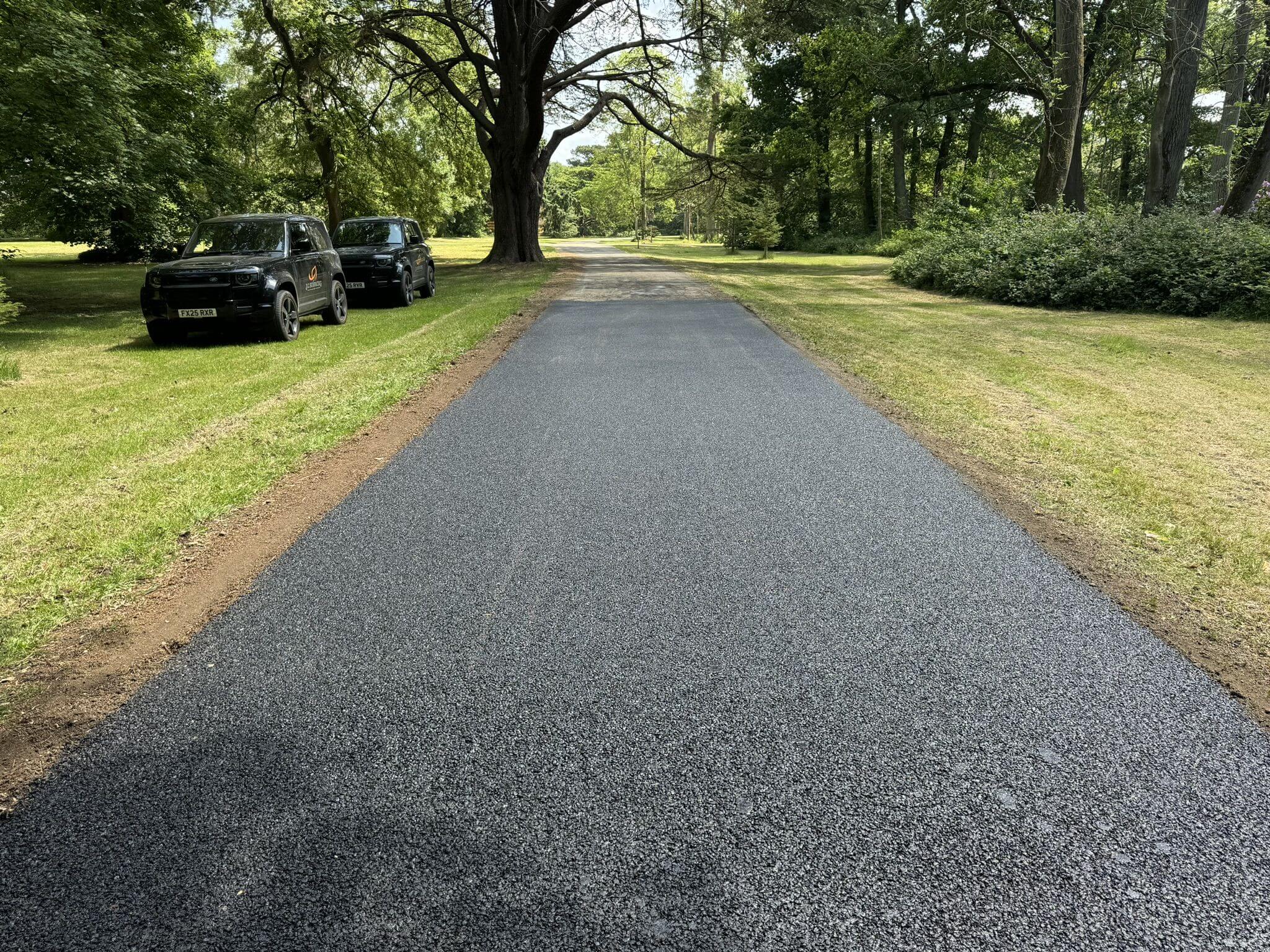 Freshly surfaced tarmac road by JC Surfacing in rural location Freshly surfaced tarmac road by JC Surfacing in rural location